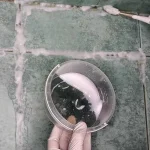 This natural compound will make the black joints between the tiles white again